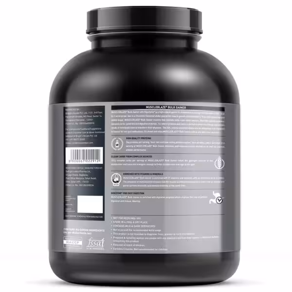 Back label of MuscleBlaze Bulk Gainer detailing 26g protein, 107g carbs, vitamins, minerals, and DigeZyme