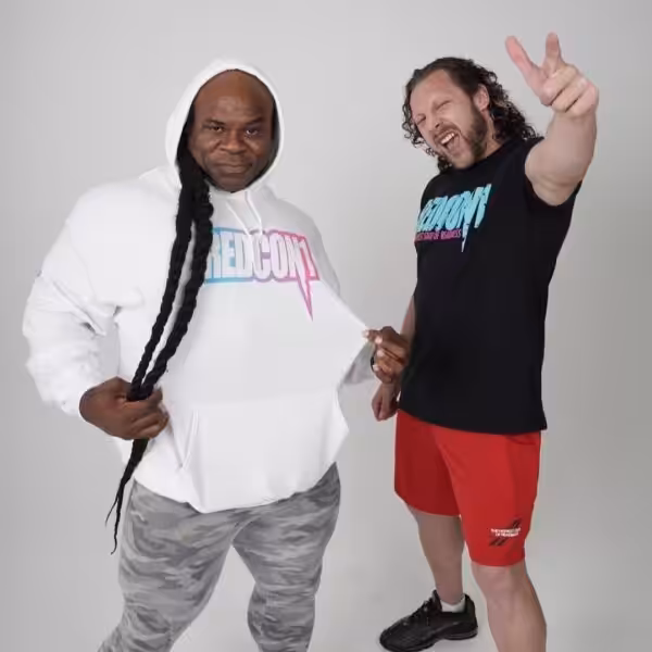 Kai Greene and Kenny Omega posing together in Redcon1 athletic apparel