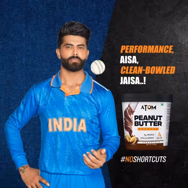 Ravindra Jadeja with Atom Chocolate Creamy Peanut Butter. Text: Performance, aisa, clean-bowled jaisa..! #NOSHORTCUTS