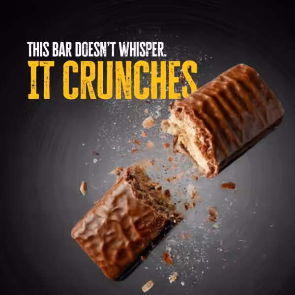 This bar doesn't whisper. It crunches. A chocolate bar snapped in half with crumbs flying
