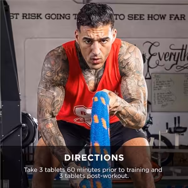Muscular man using battle ropes. Directions: Take 3 tablets 60 minutes prior to training and 3 tablets post-workout