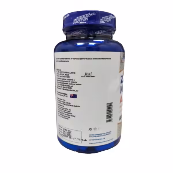 Back label of an International Protein supplement bottle showing manufacturer details, FSSAI logo, and barcode