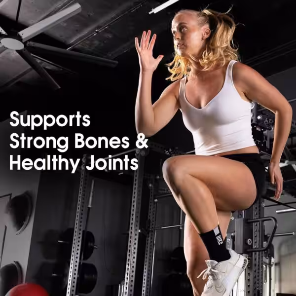 Woman exercising in a gym. Text: Supports Strong Bones & Healthy Joints