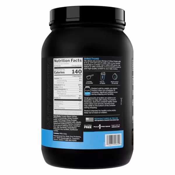 Back of Rule 1 Whey Protein container showing Nutrition Facts label with 140 calories and 24g protein per serving, ingredients, and directions