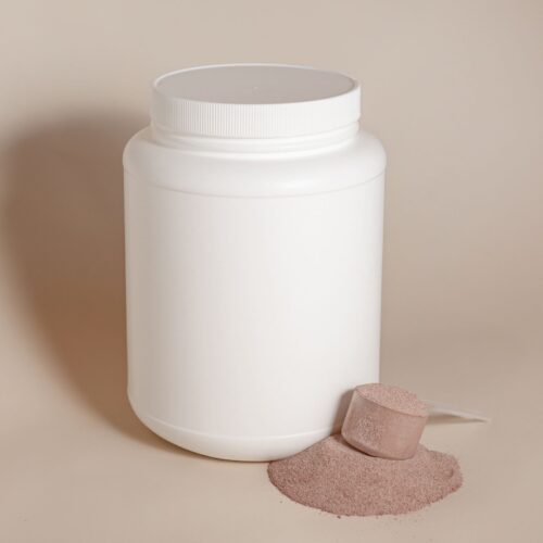 Unlabelled protein supplement tub with a scoop of powder, choosing the best Indian protein supplement