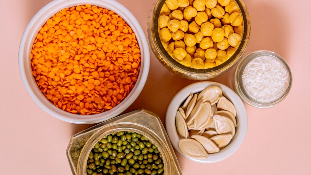 Protein supplements for vegetarians: lentils, chickpeas, mung beans and seeds in jars